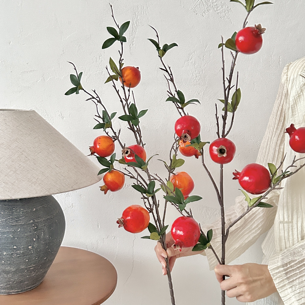 Artificial pomegranate flowers with leaves
