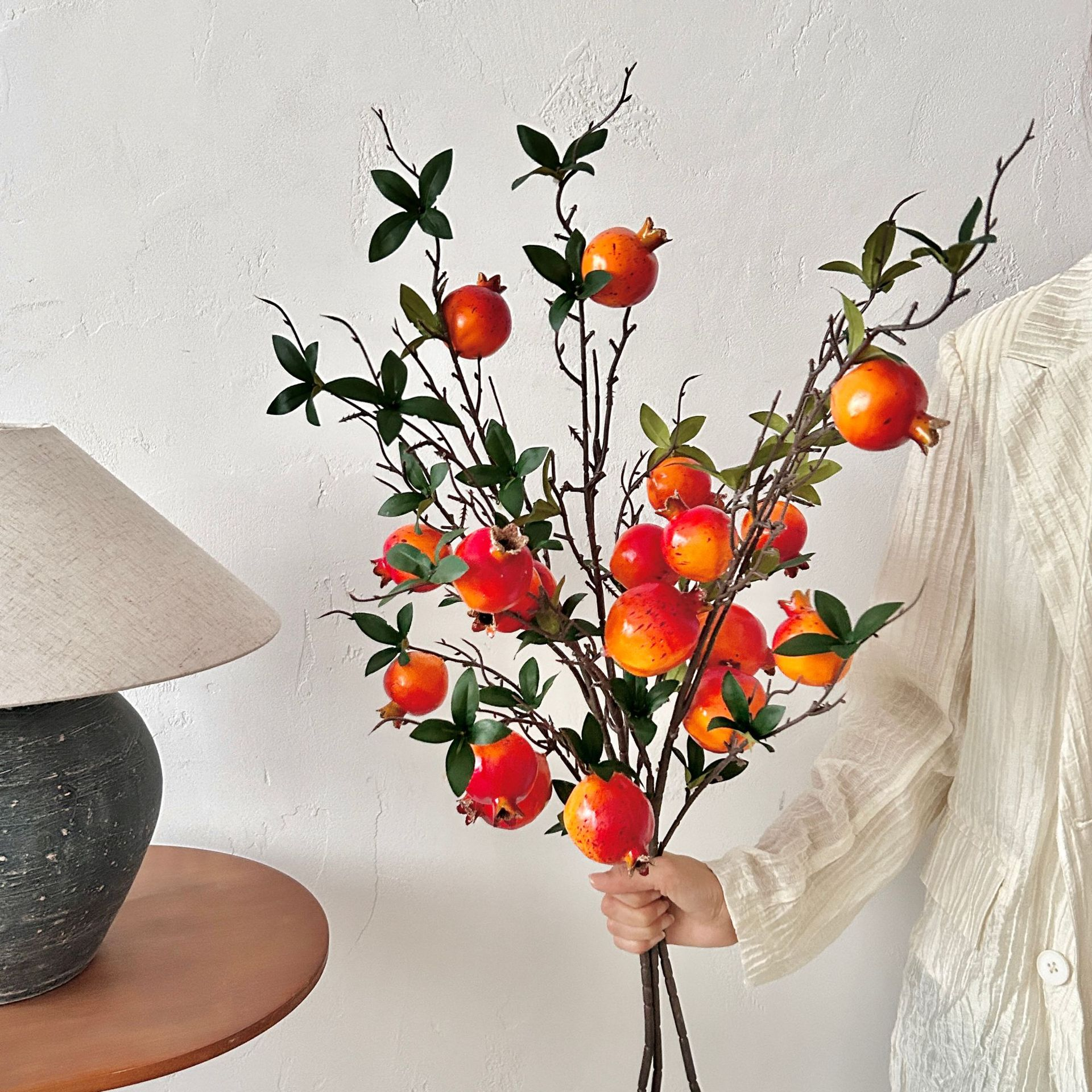 Artificial pomegranate flowers with leaves