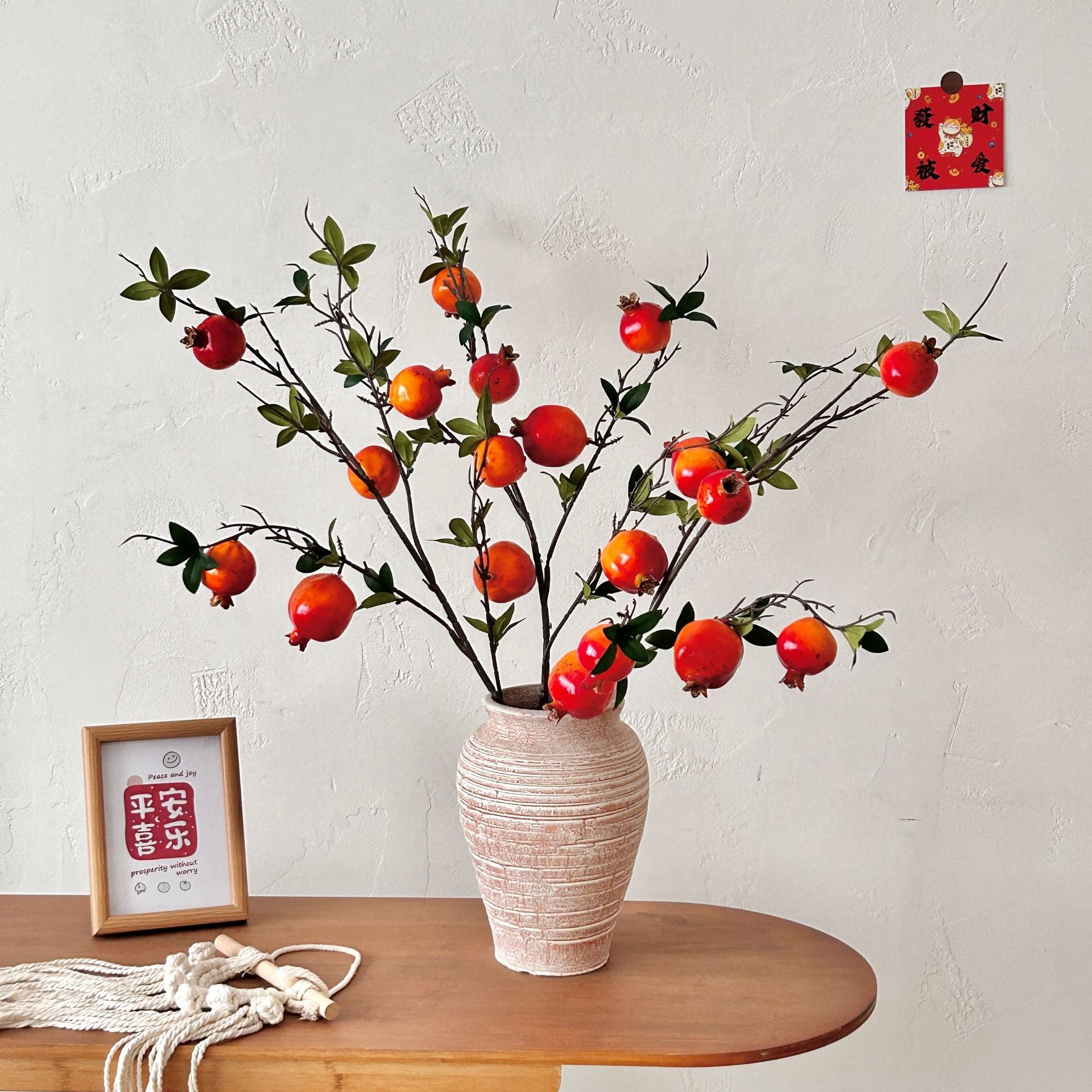 Artificial pomegranate flowers with leaves