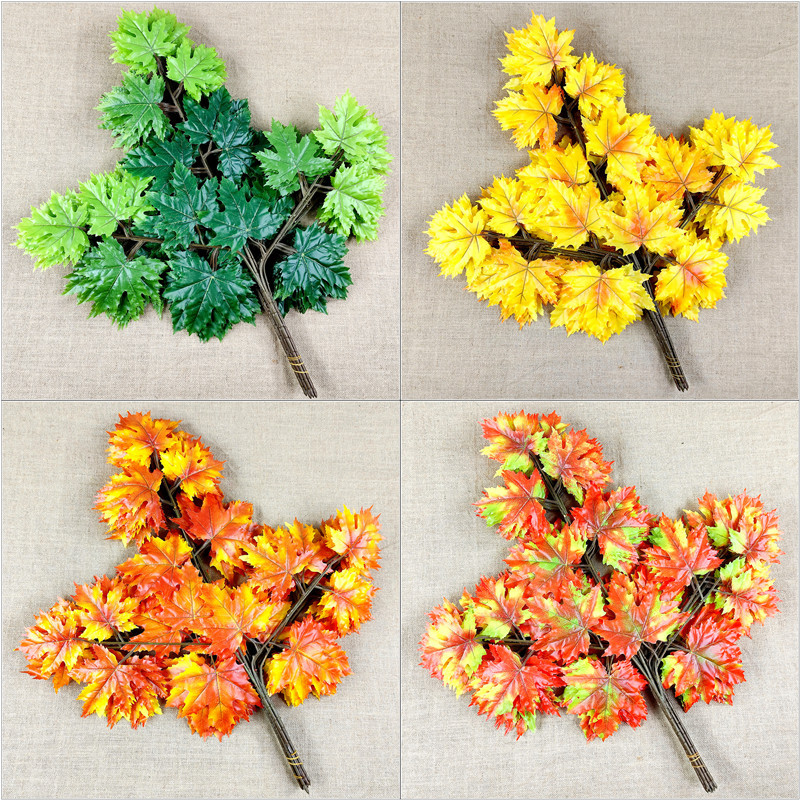 Artificial poplar and maple leaves with a tactile feel, coated with glue to resemble fake tree branches and leaves.
