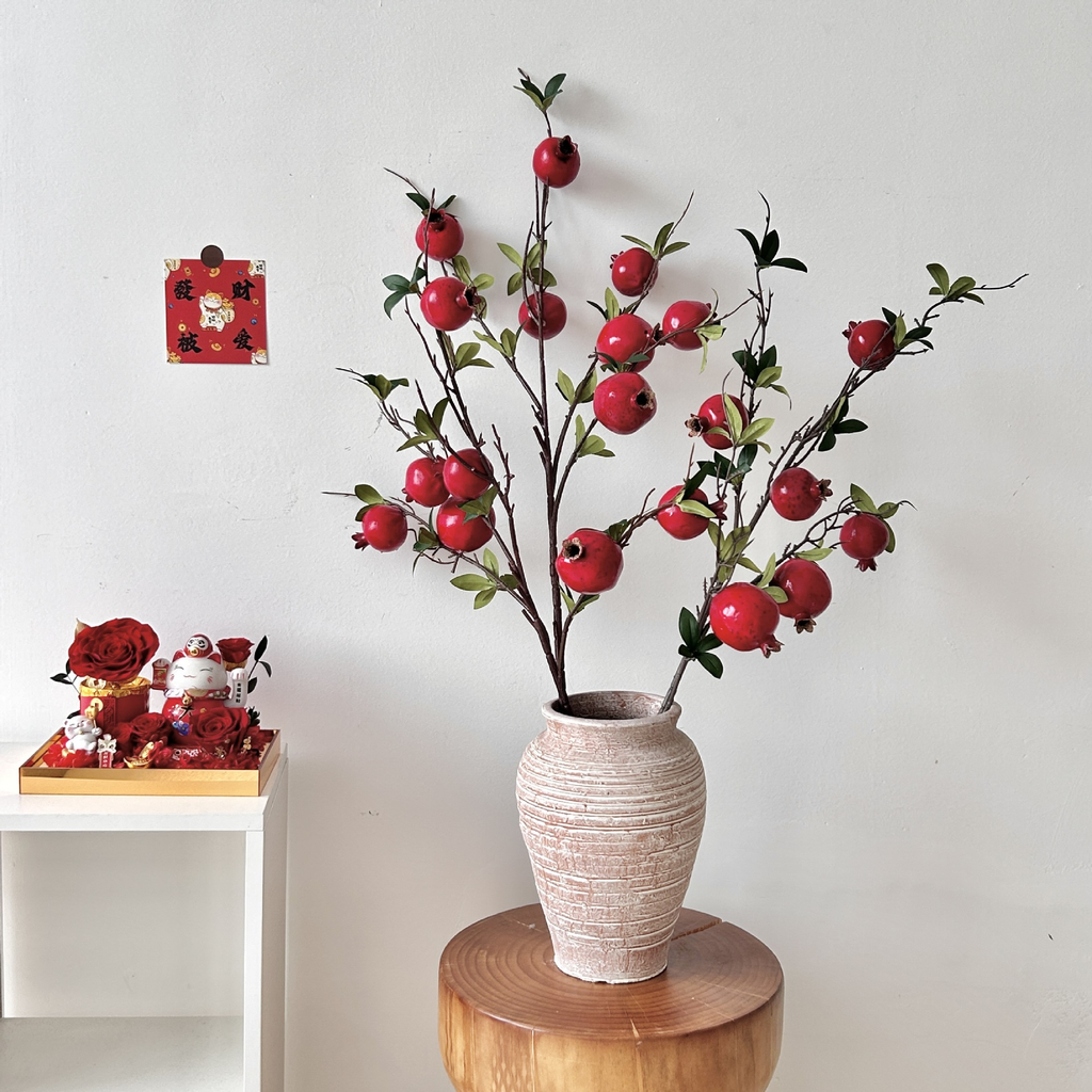 Artificial pomegranate flowers with leaves